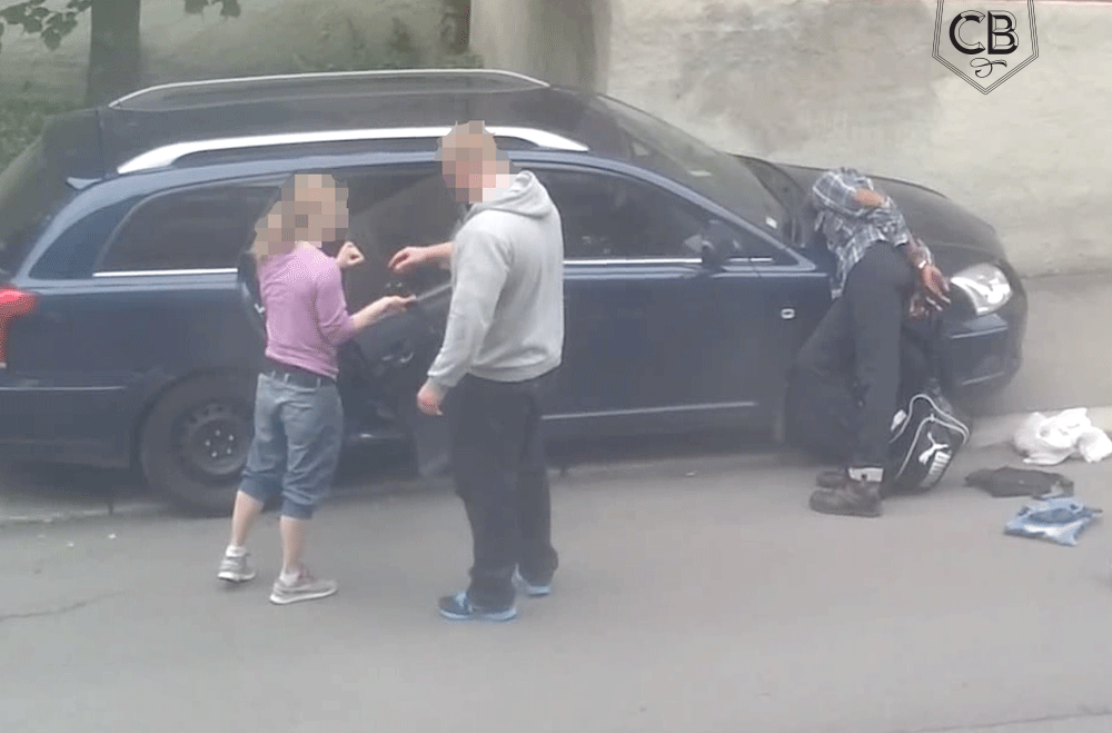 The Individual laying barely conscious on the vehicle after the special treatment.